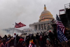 Police attempt to clear the U.S. Capitol Building with tear gas as supporters of U.S. President Donald Trump gather outside, in Washington, U.S.