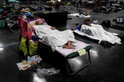 People sleep at a cooling shelter set up during an unprecedented heat wave in Portland, Oregon, U.S.