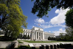 The Federal Reserve building is set against a blue sky in Washington, U.S.,