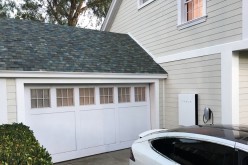  Tesla's electric car, Powerwall and solar roof are shown by Tesla Motors Inc Chief Executive Elon Musk, unveiling new energy products aimed at illustrating the benefits of combining his electric car and battery maker with solar installer SolarCity Corp,