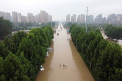 An aerial view shows a flooded road following heavy rainfall in Zhengzhou, Henan province,