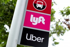 A sign marks a rendezvous location for Lyft and Uber users at San Diego State University in San Diego, California, U.S.