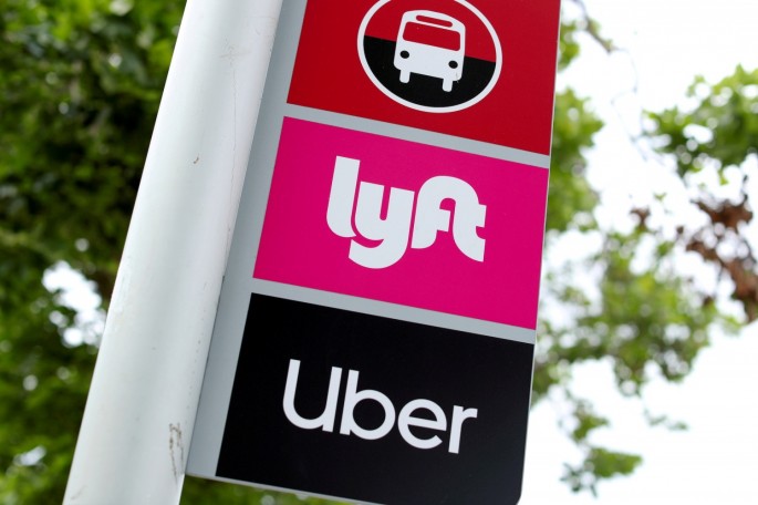 A sign marks a rendezvous location for Lyft and Uber users at San Diego State University in San Diego, California, U.S.