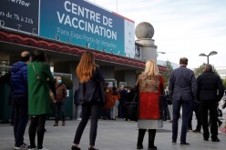 People queue outside a mass vaccination center in Paris, as part of the coronavirus disease (COVID-19) vaccination campaign in France, 