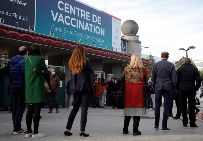 People queue outside a mass vaccination center in Paris, as part of the coronavirus disease (COVID-19) vaccination campaign in France, 