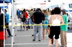 Patients wait in line to get a swab test at a COVID-19 mobile testing site hosted by the Manatee County Florida Department of Health in Palmetto, Florida, U.S.