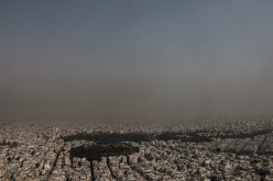 Athens covered in smoke from a wildfire burning at Varympompi suburb in suburb north of Athens, Greece,