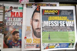 Soccer Football - FC Barcelona Press Conference - Camp Nou, Barcelona, Spain - August 6, 2021 Newspapers are seen displaying front page images of Barcelona's Lionel Messi 