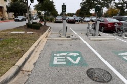 An electric vehicle (EV) fast charging station is seen in the parking lot of a Whole Foods Market in Austin, Texas, U.S.,