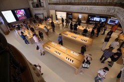 Customers browse products at the new Apple Store on Broadway in downtown Los Angeles, California, U.S.,