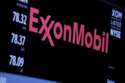 The logo of Exxon Mobil Corporation is shown on a monitor above the floor of the New York Stock Exchange in New York,