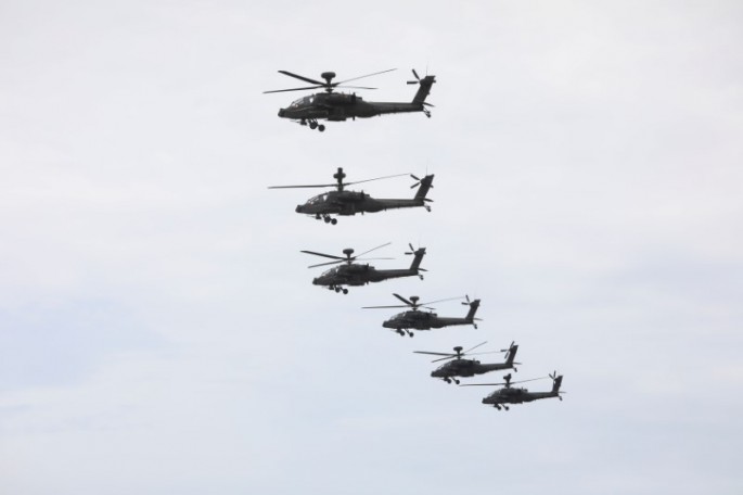 AH-64 Apache helicopters fly to location during the live-fire, anti-landing Han Kuang military exercise, which simulates an enemy invasion, in Taichung,