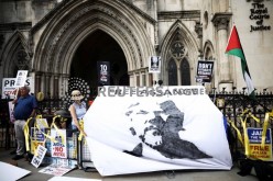 Supporters of Wikileaks founder Julian Assange gather outside the Royal Courts of Justice during the U.S. government appeal against a ruling by a British 
