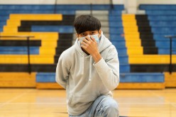 A sophomore student at Louise High School Antonio Martinez, 15, also a cross country runner, wears a mask as he poses, during the coronavirus disease (COVID-19) pandemic in Louise,