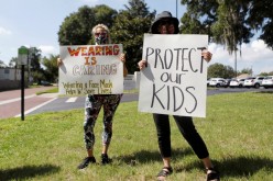 Supporters of wearing masks in schools protest before the special called school board workshop at the Pinellas County Schools Administration Building in Largo, Florida