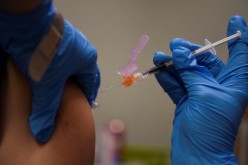 A person receives a COVID-19 vaccine at Floyd's Family Pharmacy as cases of the coronavirus disease (COVID-19) surge in Ponchatoula, Louisiana, U.S.,