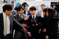 Seungri, a member of South Korean K-pop band Big Bang, arrives to be questioned over a sex bribery case at the Seoul Metropolitan Police Agency in Seoul, South Korea,