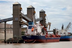Grain is loaded onto ships for export at a port on the Parana river near Rosario, Argentina,