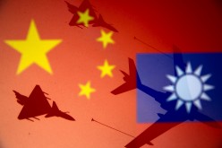 Chinese and Taiwanese national flags are displayed alongside military airplanes in this illustration taken