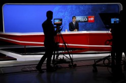 A cameraman films a news anchor at Tolo News studio, in Kabul, Afghanistan
