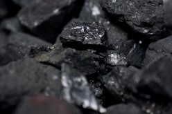 Coal is pictured in a container as people protest against BlackRock investing in coal and tar sands outside their headquarters in the Manhattan borough of New York City, New York, U.S.