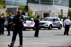 Police officers man a police barricade while responding to a bomb threat near the U.S. Capitol in Washington, U.S.,