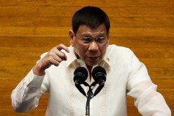 Philippine President Rodrigo Duterte gestures as he delivers his 6th State of the Nation Address (SONA), at the House of Representative in Quezon City, Metro Manila