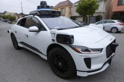 A Waymo Jaguar I-Pace SUV is seen driving on a road in San Francisco, California, U.S.