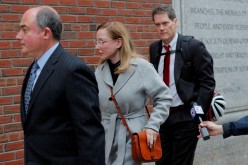Marci Palatella (C), the CEO of a liquor distribution company facing charges in a nationwide college admissions cheating scheme, arrives at the federal courthouse in Boston, Massachusetts, U.S.,