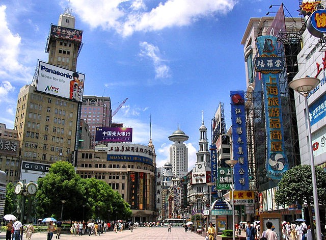 Nanjing Road flanked by buildings and establishments that signify China's performing economy.