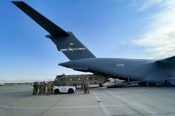 A CH-47 Chinook is loaded onto a U.S. Air Force C-17 Globemaster III at Hamid Karzai International Airport in Kabul, Afghanistan