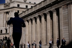 People walk past the Bank of England during morning rush hour, amid the coronavirus disease (COVID-19) pandemic in London, Britain