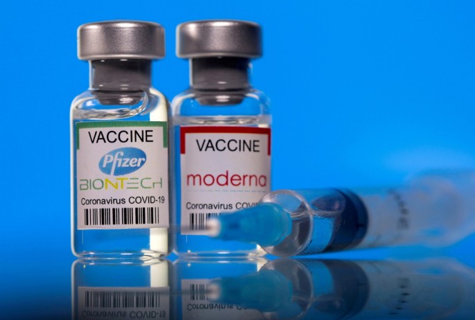 Vials with Pfizer-BioNTech and Moderna coronavirus disease (COVID-19) vaccine labels are seen in this illustration picture taken