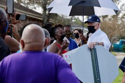 U.S. President Joe Biden talks to residents as he tours a neighbourhood hit by Hurricane Ida in LaPlace, Louisiana, U.S.