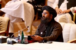 Mullah Abdul Ghani Baradar, the leader of the Taliban delegation, speaks during talks between the Afghan government and Taliban insurgents in Doha, Qatar