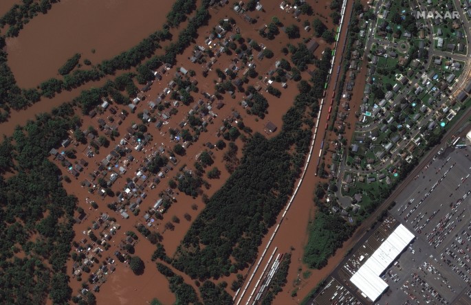 A satellite image shows a rail yard and homes along Huff Avenue submerged in floodwater after torrential rains swept through Manville, New Jersey, U.S.