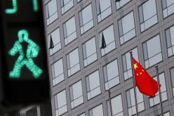 A Chinese national flag flutters outside the China Securities Regulatory Commission (CSRC) building on the Financial Street in Beijing, China 