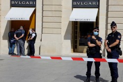 French police stand in front of the Bulgari jewellery store following a robbery at Place Vendome in Paris, France,