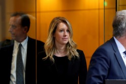 Former Theranos CEO Elizabeth Holmes leaves after a hearing at a federal court in San Jose, California,