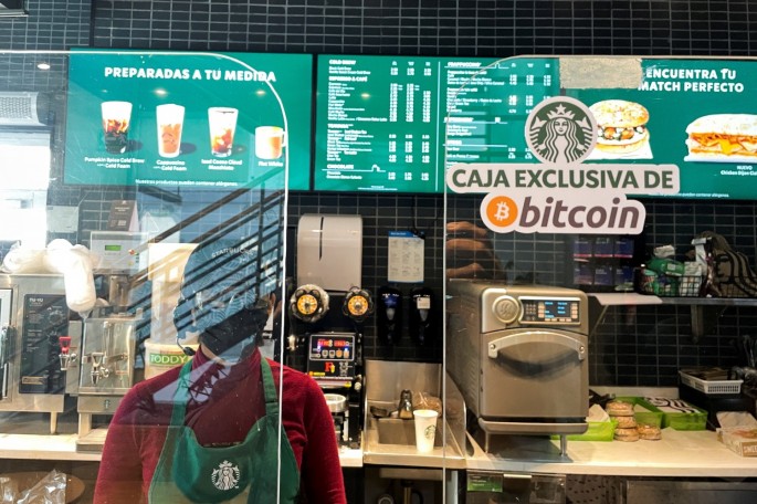 A sign reads: "Exclusive Bitcoin register" in a Starbucks store where the cryptocurrency is accepted as a payment method, in San Salvador, El Salvador