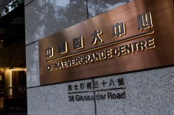 The China Evergrande Centre building sign is seen in Hong Kong, China.