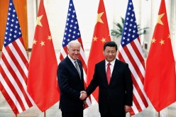 Chinese President Xi Jinping shakes hands with U.S. Vice President Joe Biden (L) inside the Great Hall of the People in Beijing 