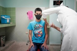 A 14-year-old boy gets a dose of the Soberana 02 vaccine during its clinical trials at a hospital amid concerns about the spread of the coronavirus disease (COVID-19) in Havana, Cuba,