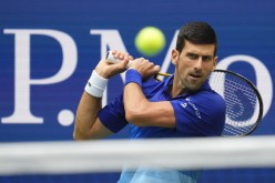 Sep 12, 2021; Flushing, NY, USA; Novak Djokovic of Serbia hits to Daniil Medvedev of Russia in the men's singles final on day fourteen of the 2021 U.S.