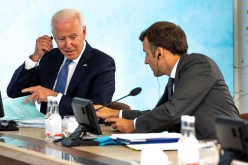U.S. President Joe Biden talks with French President Emmanuel Macron at the final session of the G7 summit in Carbis Bay, Cornwall in Britain, 