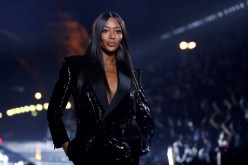 Naomi Campbell presents a creation by designer Anthony Vaccarello as part of his Spring/Summer 2020 women's ready-to-wear collection show for fashion house Saint Laurent during Paris Fashion Week in Paris, France,