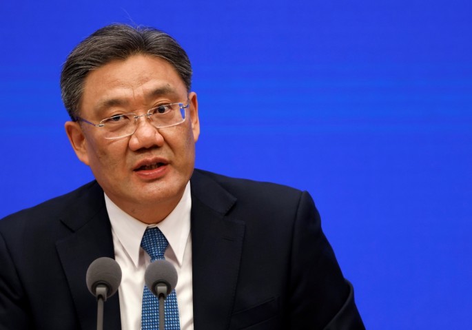 Chinese Commerce Minister Wang Wentao attends a State Council Information Office news conference in Beijing, China