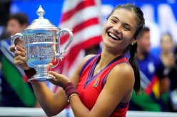 Sep 11, 2021; Flushing, NY, USA; Emma Raducanu of Great Britain celebrates with the U.S. Open trophy after winning her maiden Grand Slam title at the USTA Billie Jean King National Tennis Center.