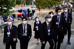 Members of the South Korean band BTS arrive at security check-in at the United Nations headquarters during the 76th Session of the U.N. General Assembly, in New York, U.S