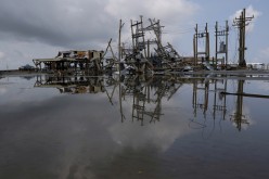 Damaged power lines and homes can be seen days after hurricane Ida ripped through Grand Isle, Louisiana, U.S.,